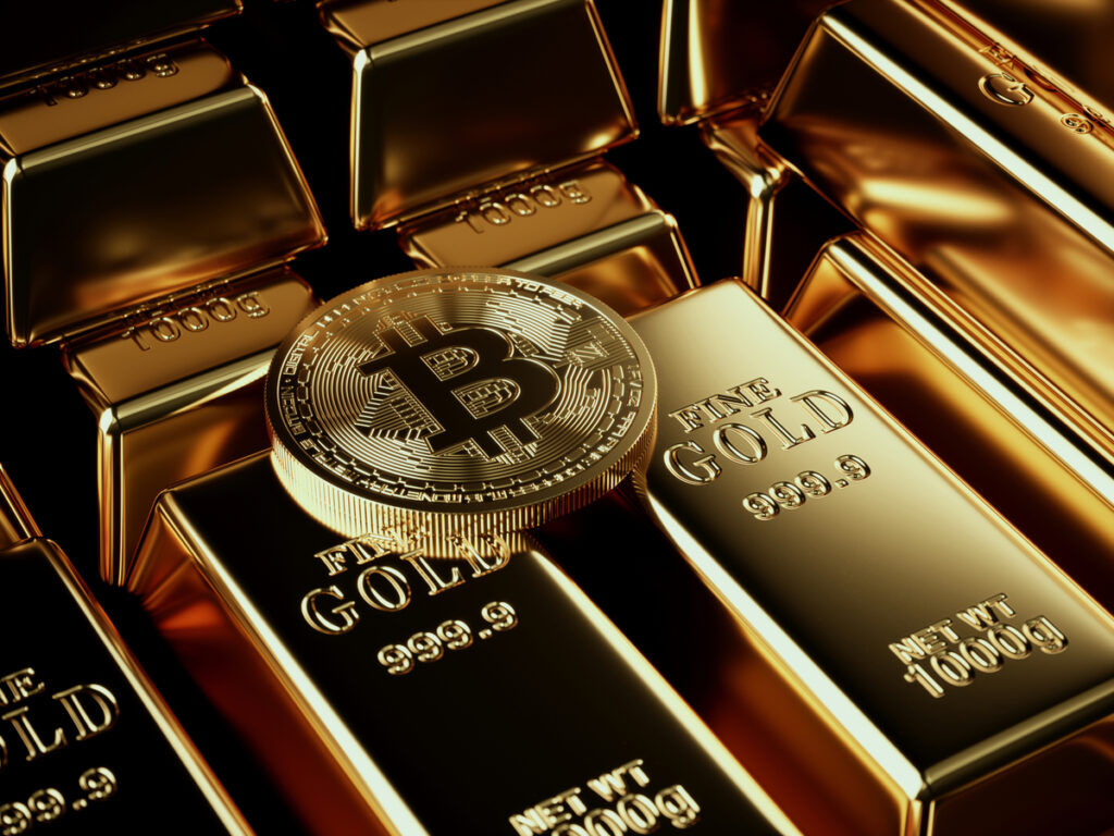 A Bitcoin physical coin on piles of gold