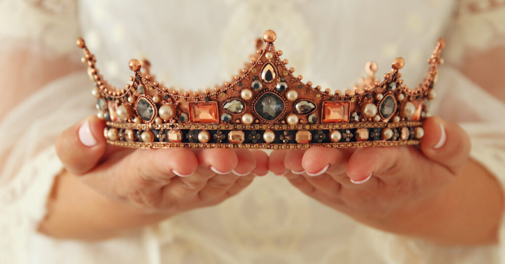 A woman holding a crown