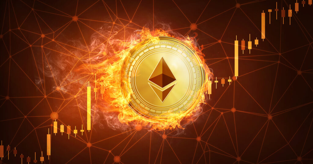 Gold Ethereum coin burning in front of a candlestick chart