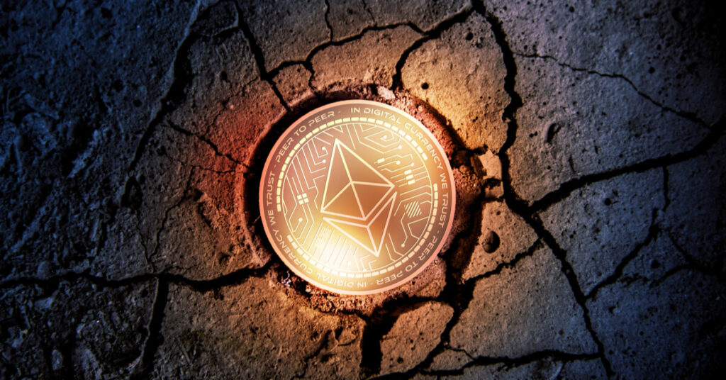 Ethereum coin on cracked ground