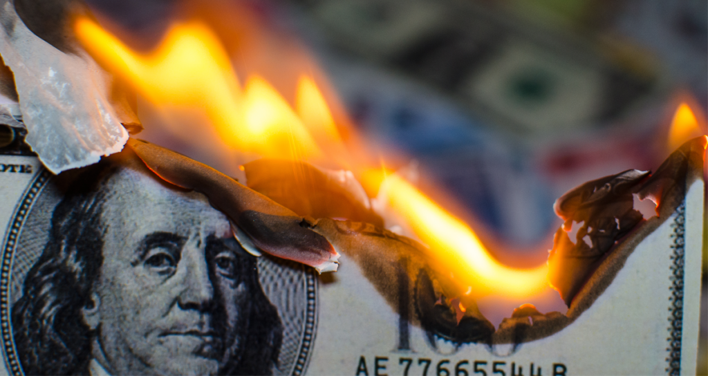 A US dollar bill burning