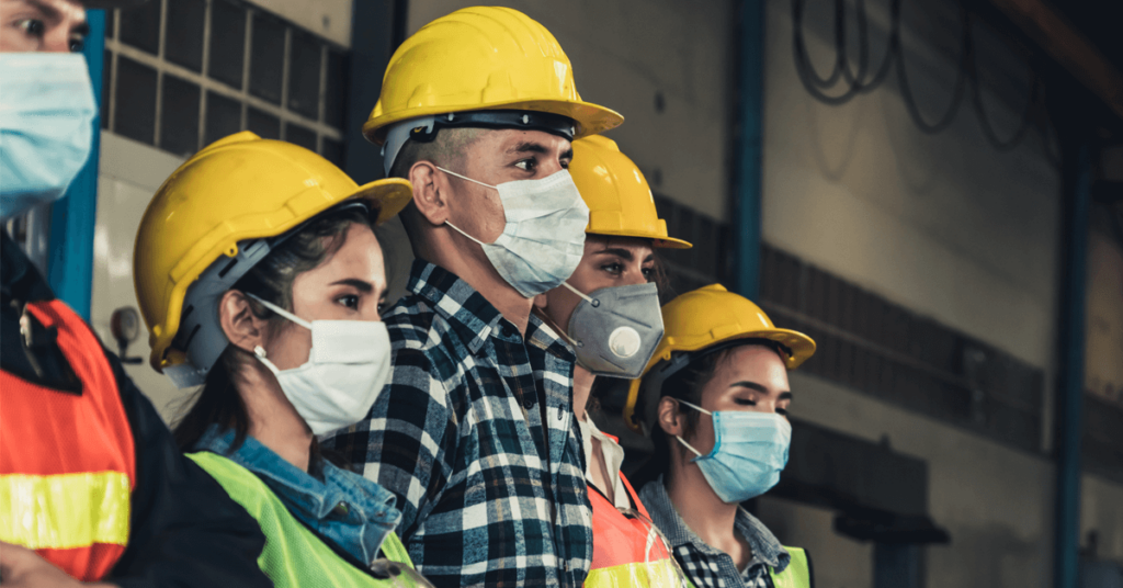 A group of workers wearing face masks