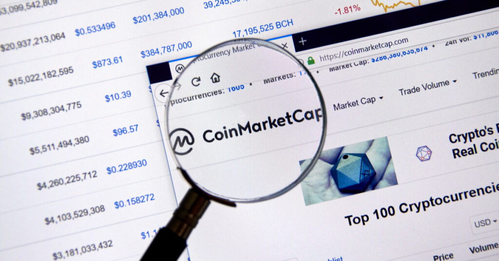 CoinMarketCap website with a magnifying lens on it