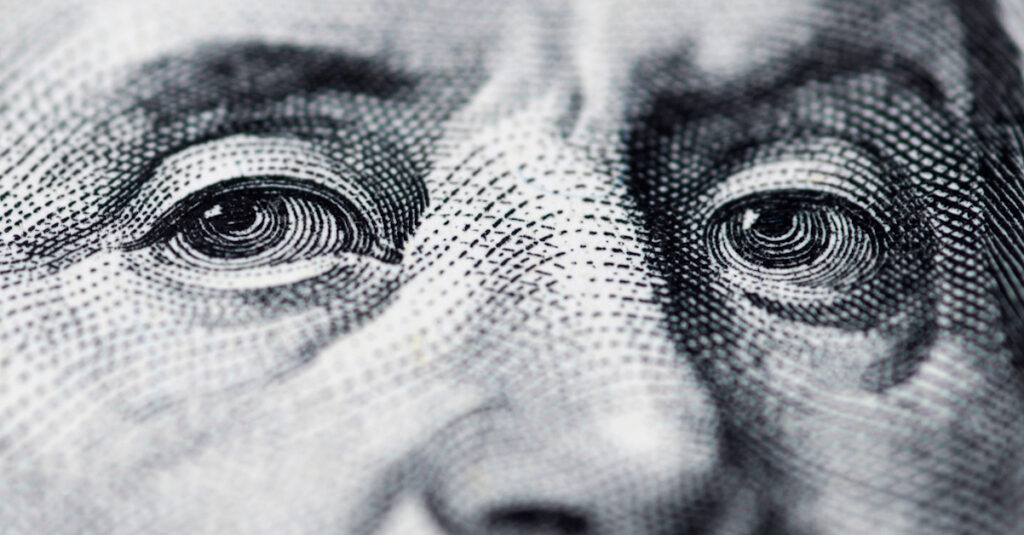 Eyes of Benjamin franklin closeup on US dollar note