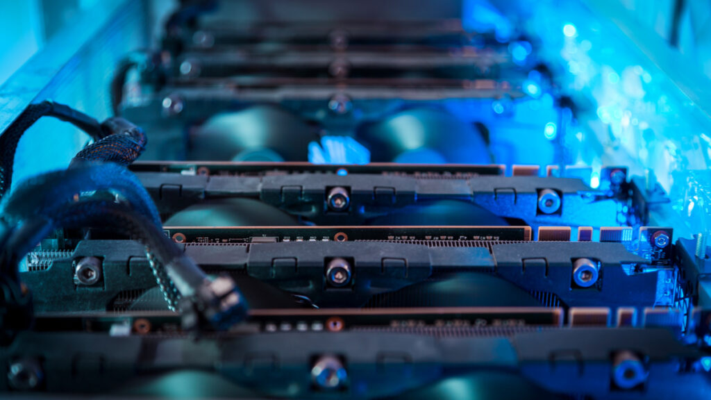 computer chips used for bitcoin mining lined up in blue glowing light