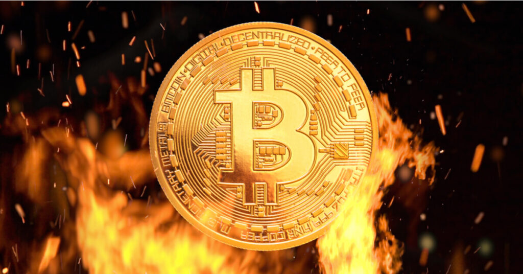 Bitcoin coin surrounded by flames