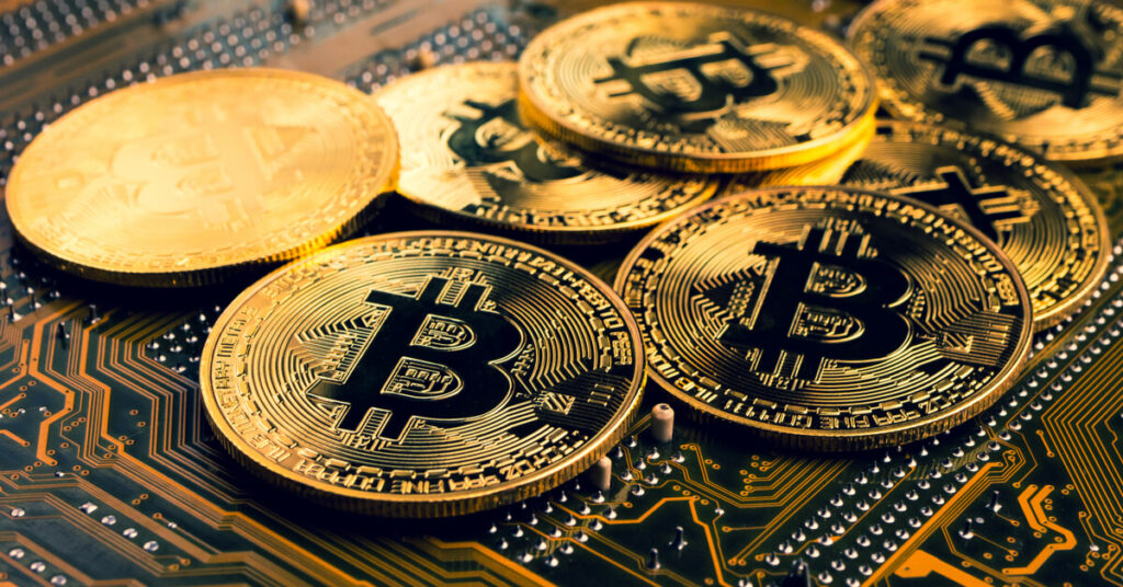 bitcoins on chipboard
