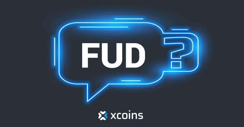 a blue speech bubble with the text FUD in it on a black background