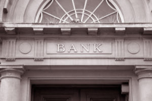 Facade of an old building with word bank on it
