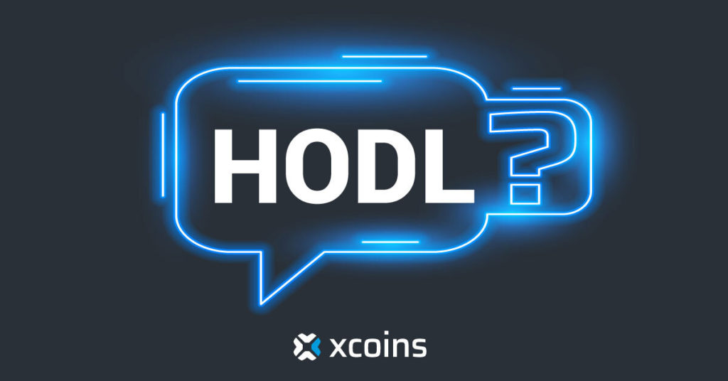 A blue speech bubble with text HODL in it on a black background