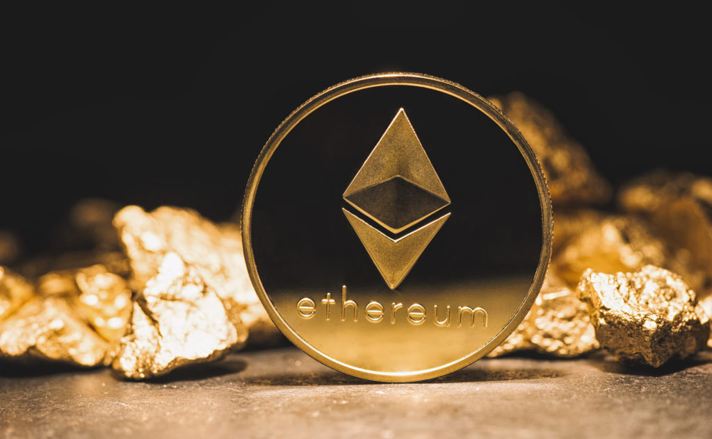 Golden Ethereum coin surrounded by gold