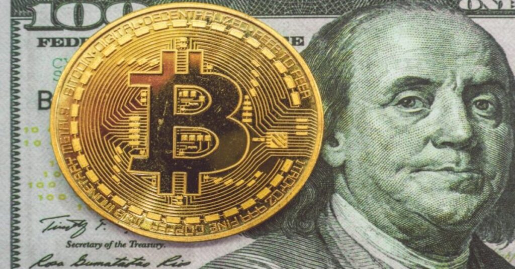 Gold Bitcoin on a 100USD banknote