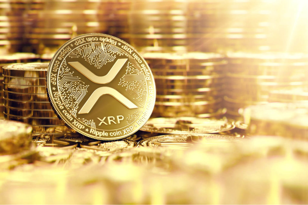 Image of an XRP ripple coin with other coins in the background.