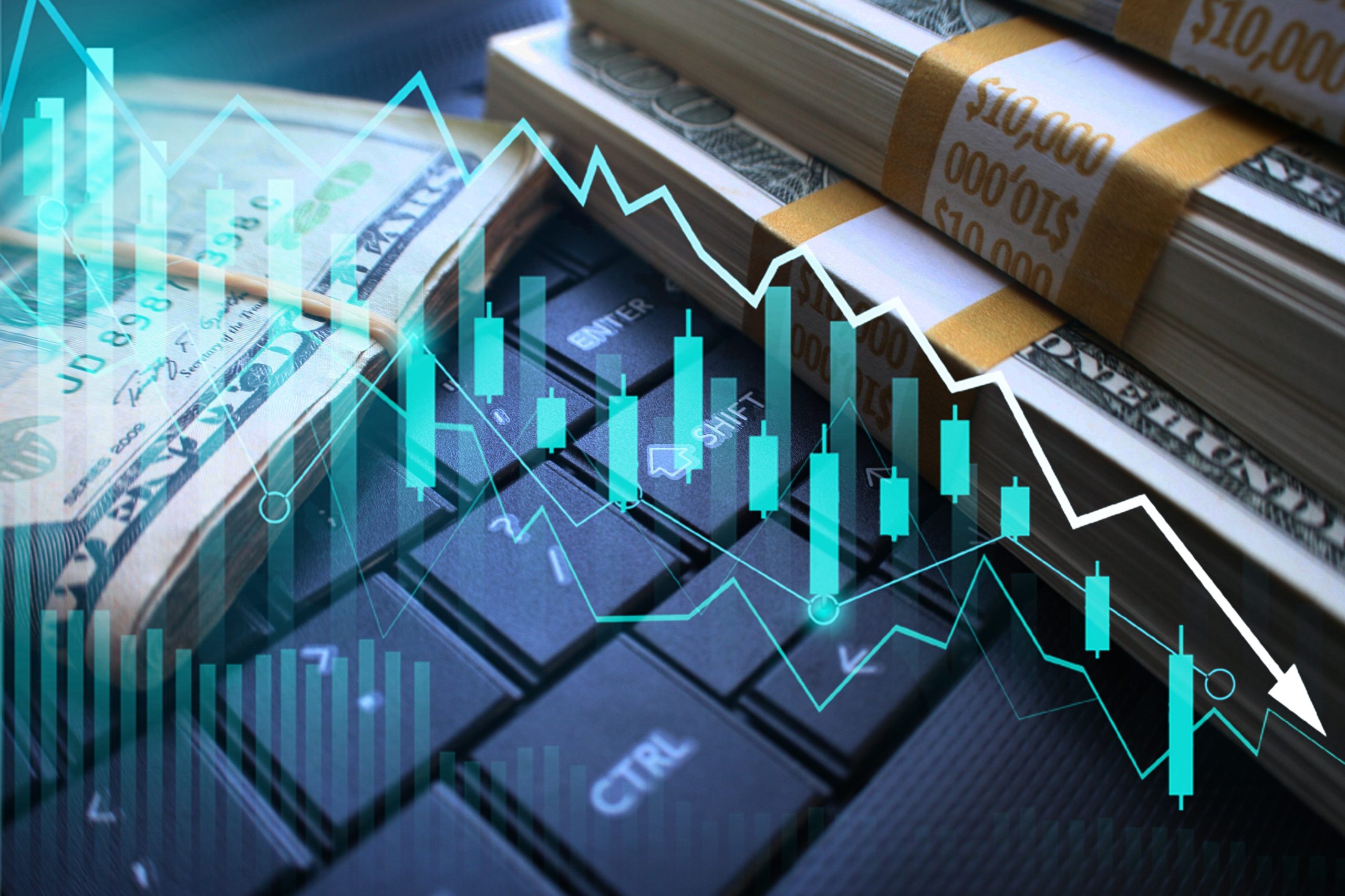 A computer keyboard with bank notes next to it with a candle graph overlaid on it