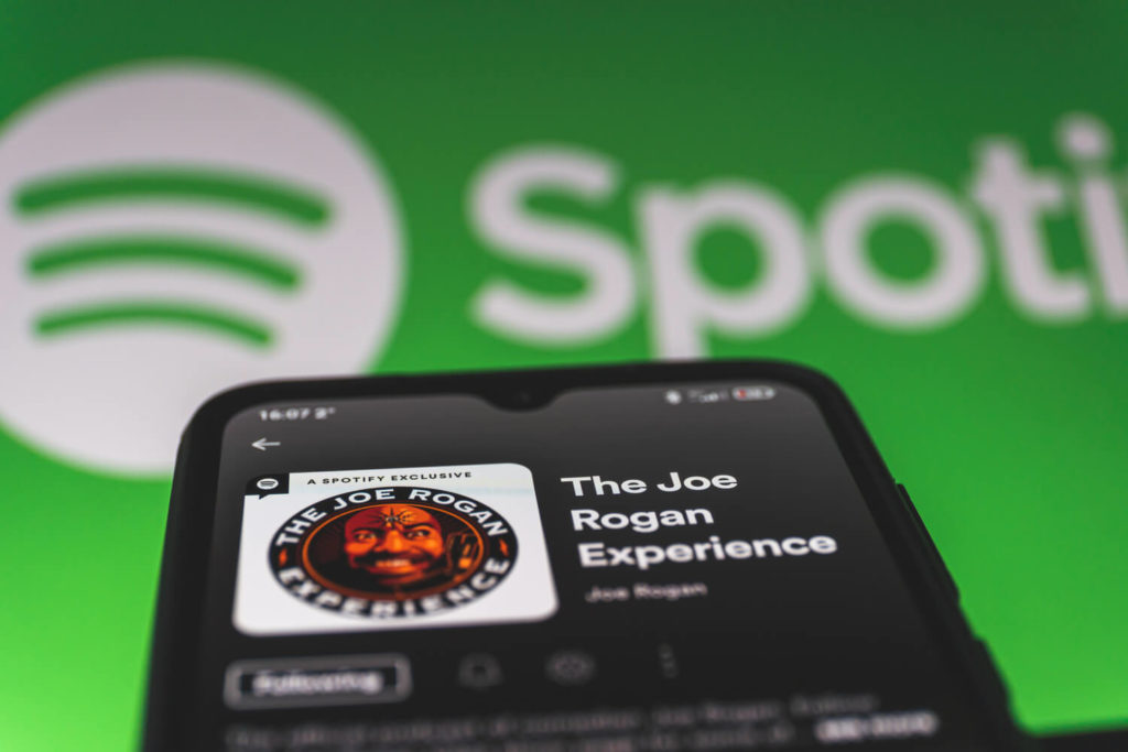 Image of Joe Rogan experience podcast in front of the Spotify 