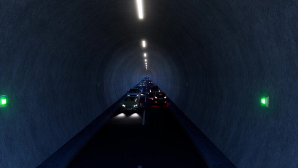 Photo of  a long, dark tunnel with cars  with their headlights on