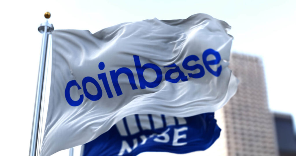 An image of a flag with the Coinbase logo printed on it
