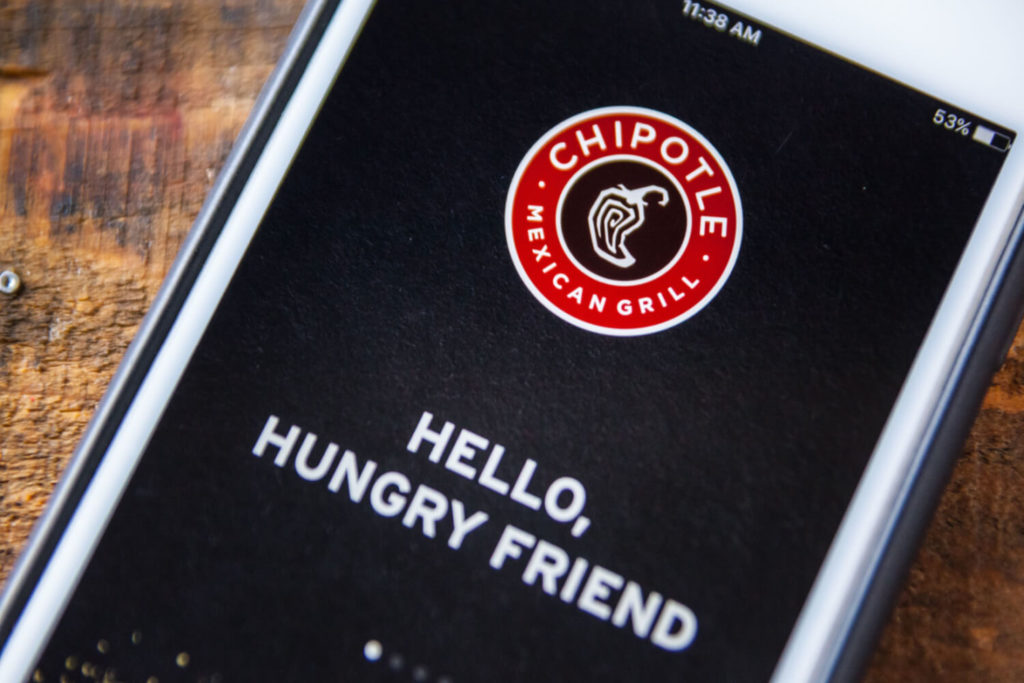 An image of a smartphone displaying the Chipotle logo
