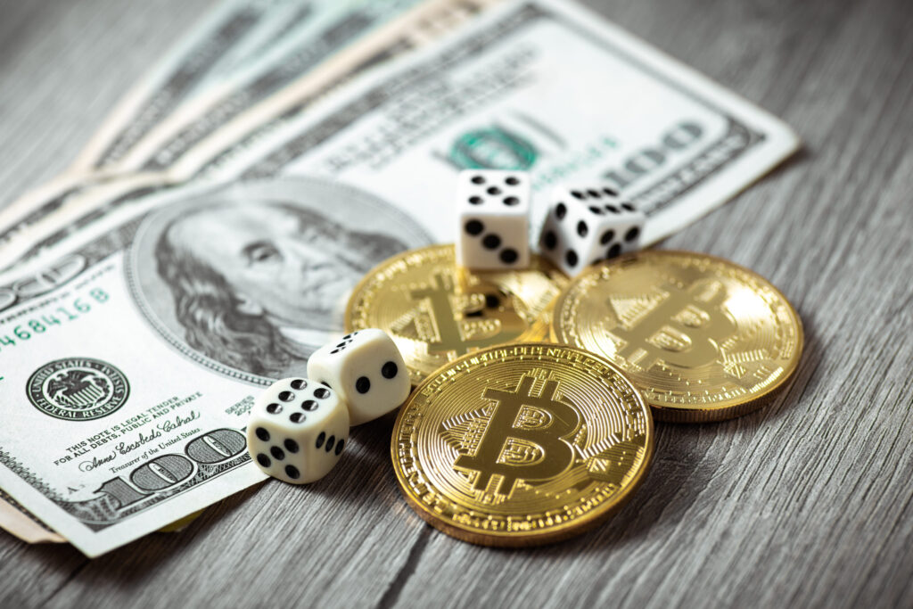 Us dollars next ti gold Bitcoin coins and 2 dice