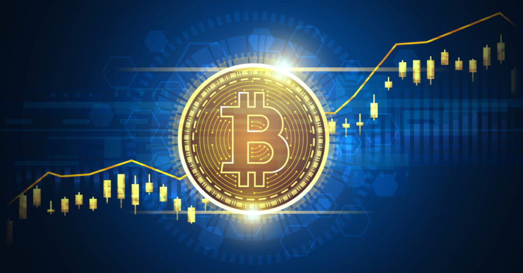 Gold Bitcoin on a blue background and trading candles going up and down on each side of the coin