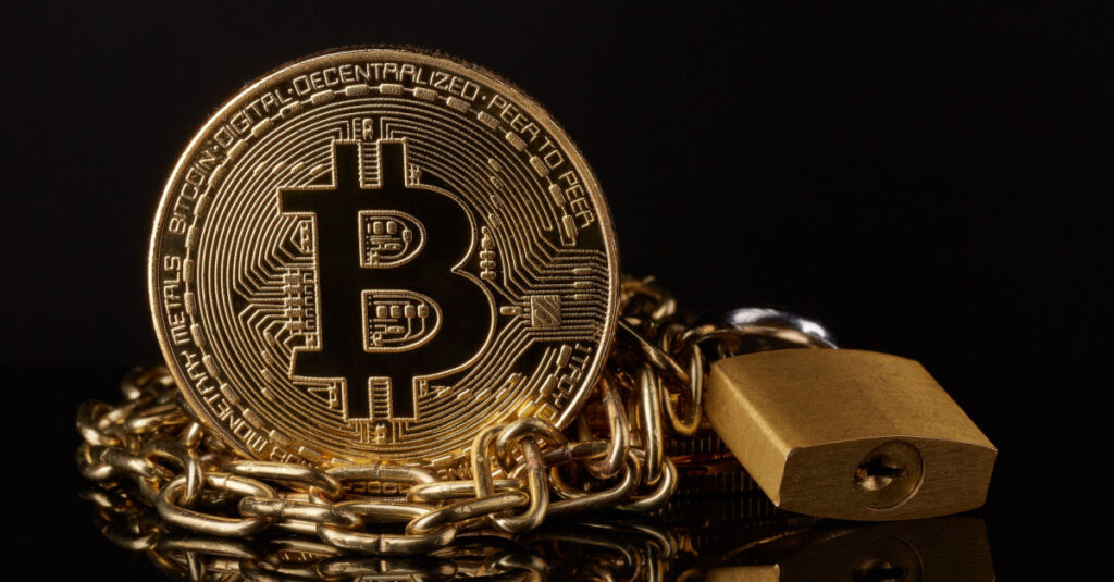 A graphical depiction of a gold bitcoin besides a gold chain representing security from blockchain.