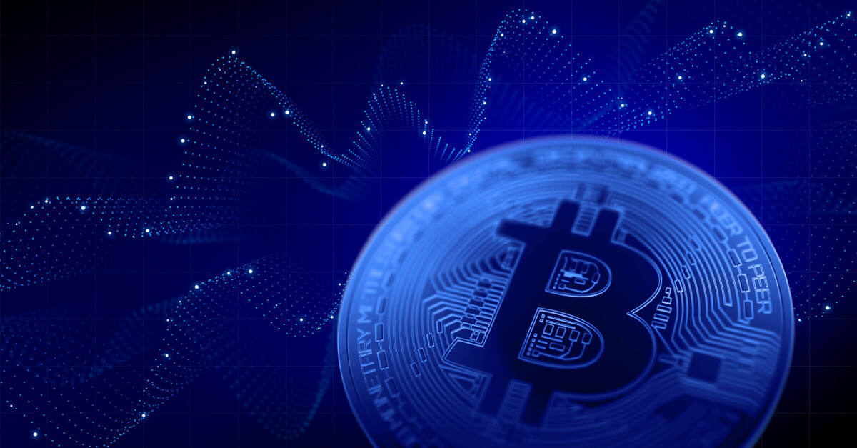blue bitcoin in front of artistic waves background representing crypto price charts