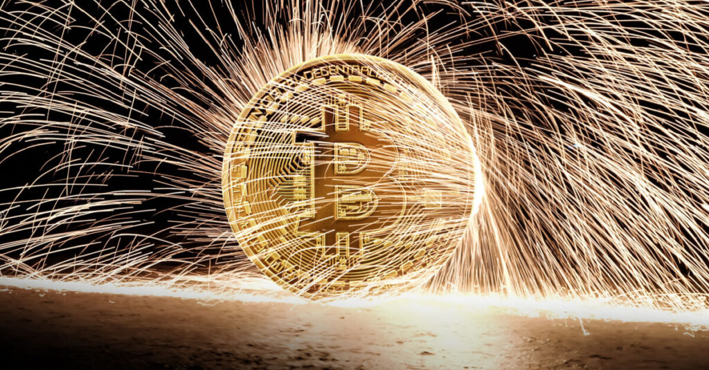 btc with sparks flying off gold coin into the dark