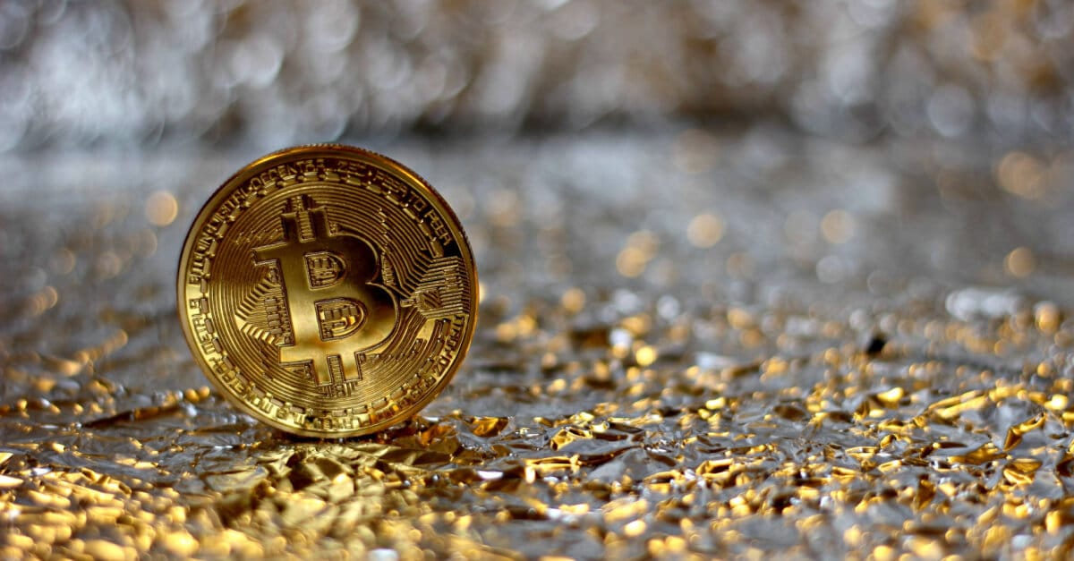 gold bitcoin on gold floor