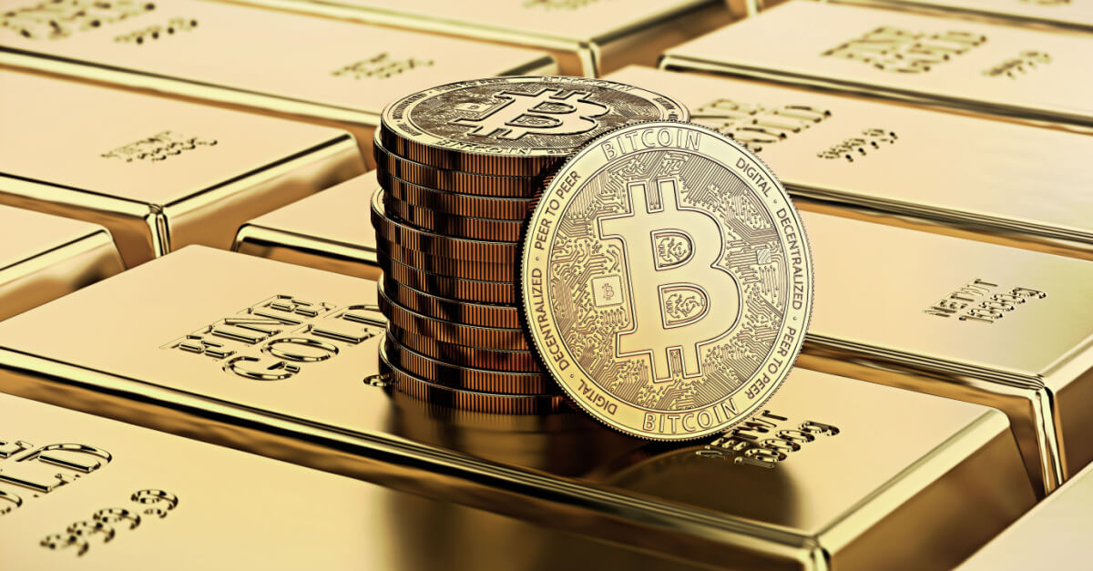 gold bitcoin stack sitting atop gold bars bullion