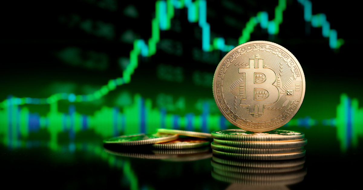 gold bitcoin on green background